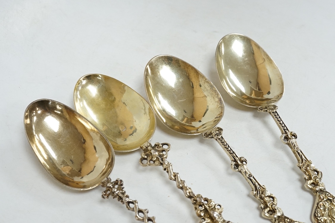 Four 19th century Dutch gilt white metal spoons, including a pair with import marks for Louis Landsberg, London, 1890, 83mm, 7.2oz.